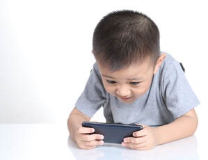 Photo of child with phone